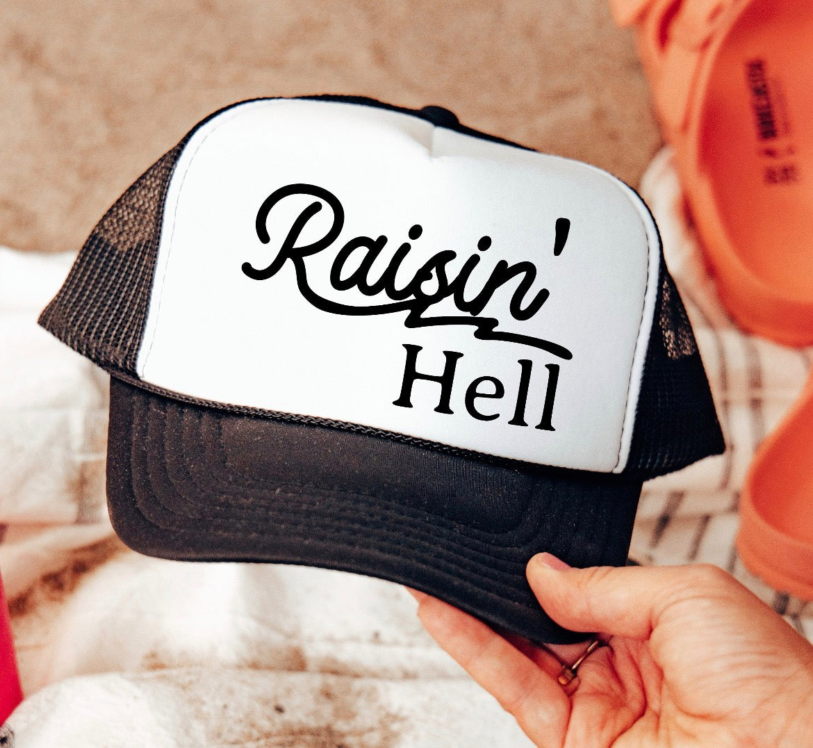 Raisin’ Hell Trucker Hat