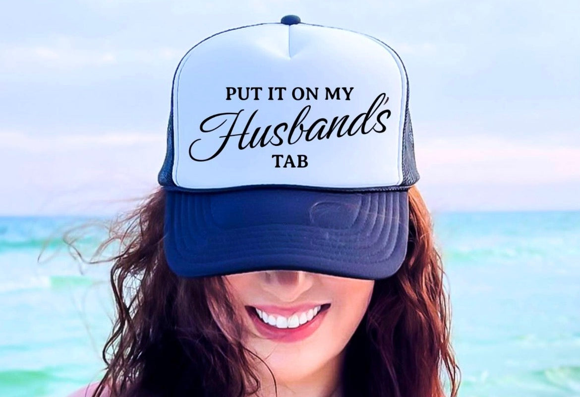 Put It On My Husbands Tab Trucker Hat